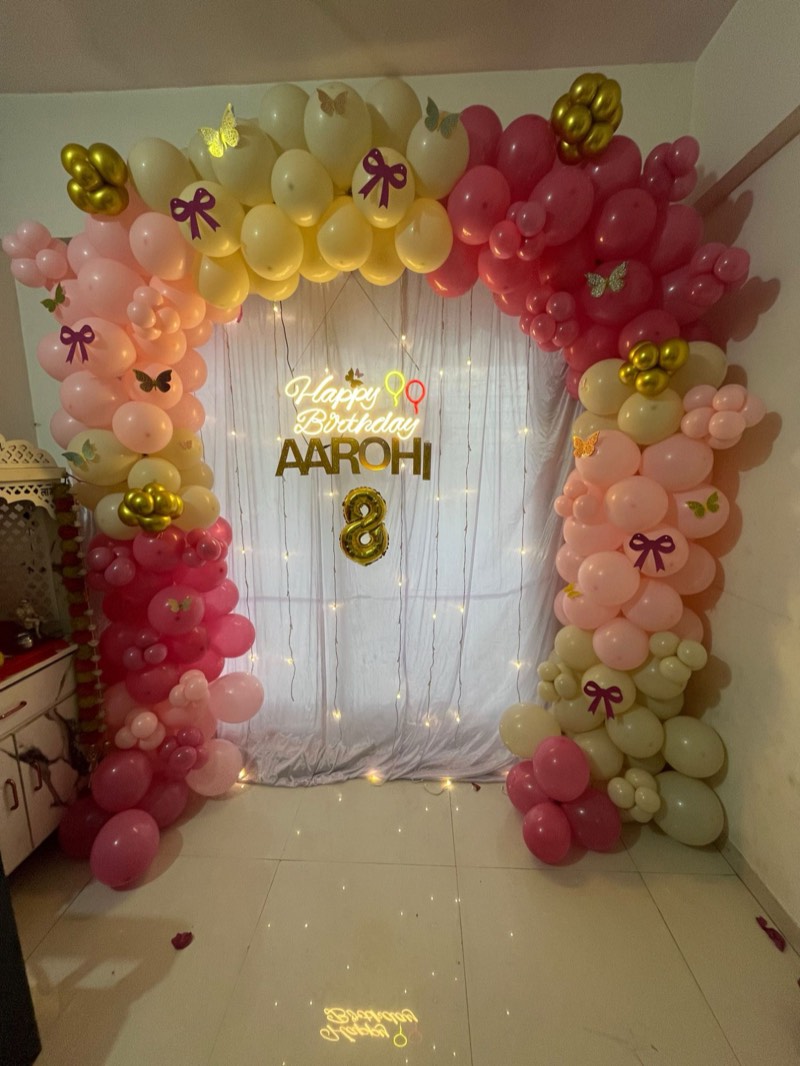 Blush, berry and ivory balloon garland with butterflies and fairy lights